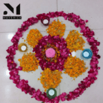 circle rangoli design with flowers and diya maverick